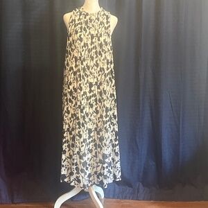 A New Day Dress elegant, black, and white sleeveless dress.
